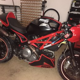 Bent rear wheel, damage to frame slider, tank cover, belly pan, right side controls, headlight fairing, exhaust cans, and clutch cover