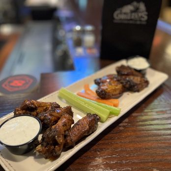 Grizzly's Grill Smoke & Fire - Wood fired wings - half with the Buffalo rub and the other with Thai chili sauce. The blue cheese dressing was made in house - delicious! - Bars Near Me - Baxter, Minnesota Grizzly's Grill Smoke & Fire - Wood fired wings - half with the Buffalo rub and the other with Thai chili sauce. The blue cheese dressing was made in house - delicious! - Bars Near Me - Baxter, Minnesota
