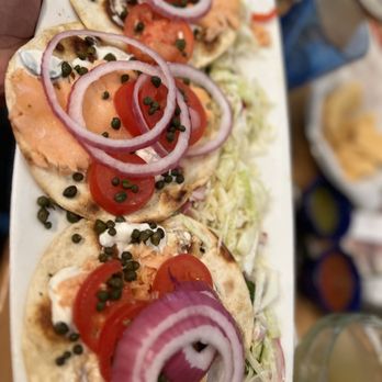 La Calle Doce - a person holding a plate of food - Seafood Near Me - Dallas, Texas La Calle Doce - a person holding a plate of food - Seafood Near Me - Dallas, Texas