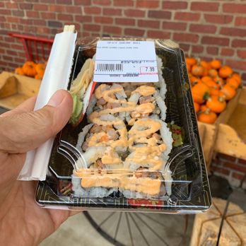 Sushi Garden - a hand holding a container of sushi - Sushi Bars Near Me - Charleston, West Virginia Sushi Garden - a hand holding a container of sushi - Sushi Bars Near Me - Charleston, West Virginia