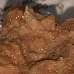 Chocnut -Annie's Sweets Manufacturing and Packaging Corp. - We noticed something sharply crystallized like human nail shaped inside the choc*nut bar.