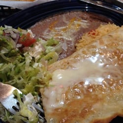 El Ranchero Mexican Restaurant - Shredded chicken quesadilla ! Stuffed with lots of chicken & cheese, rices, beans, sour cream, guacamole & pico de gallo.