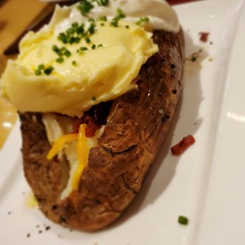 Center Cut - A very loaded baked potato. This thing was huge! - Steakhouses Near Me - Shelbyville, Indiana Center Cut - A very loaded baked potato. This thing was huge! - Steakhouses Near Me - Shelbyville, Indiana