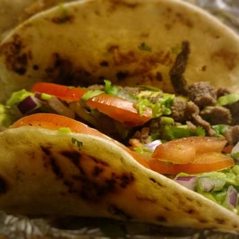 Taqueria El Lugar - two tacos on tin foil - Mexican Near Me - Tyler, Texas Taqueria El Lugar - two tacos on tin foil - Mexican Near Me - Tyler, Texas