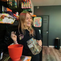 Trap House Dispensary - Experience precision at Traphouse Dispensary. Our budtender weighs out premium flower for your satisfaction. #CannabisDispensary
