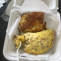 Meat lovers omelet with your choice of sides that includes hashbrowns and pancakes Meat lovers omelet with your choice of sides that includes hashbrowns and pancakes