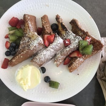 Tostado - French toast with coconut flakes and fruits - Breakfast & Brunch Near Me - San Juan, Puerto Rico Tostado - French toast with coconut flakes and fruits - Breakfast & Brunch Near Me - San Juan, Puerto Rico