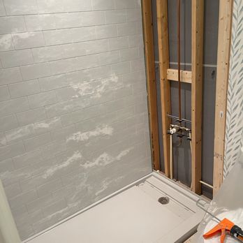 Upgrade Remodeling - Expertly installing the new shower - General Contractors Near Me - Yorktown, Virginia