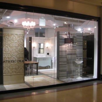 Artistic Tile - a bathroom with a chandelier in the window - Flooring Near Me - Chicago, Illinois