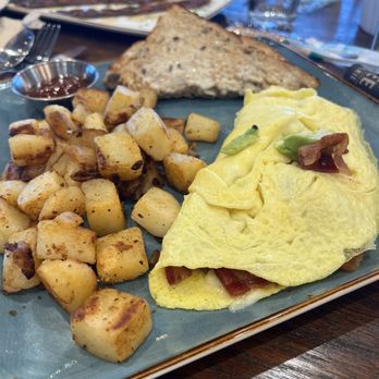 First Watch - Bacando omelet (bacon, cheese and avocado) with potatoes - Breakfast & Brunch Near Me - San Marcos, Texas