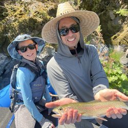 Jack Trout Fly Fishing Guide - Unforgettable fishing trip with my son. Together we landed this 18 inch rainbow, Brandon with the successful net and Jack on the oars.