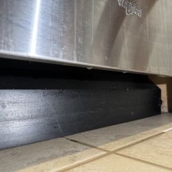 Appliance Superheroes - Drops of water clearly leaking from the front of the dishwasher.