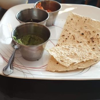 Taste of India - Papadoms with tamarind, (I think curried onions but not sure) then with cilantro stuff - Indian Near Me - Madison, Wisconsin Taste of India - Papadoms with tamarind, (I think curried onions but not sure) then with cilantro stuff - Indian Near Me - Madison, Wisconsin