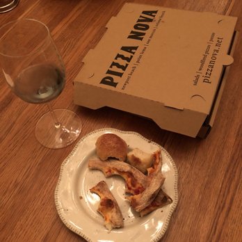 Pizza Nova - Couldn't even eat the crust! Note the box size next to a salad plate and wine glass - Italian Near Me - San Marcos, California Pizza Nova - Couldn't even eat the crust! Note the box size next to a salad plate and wine glass - Italian Near Me - San Marcos, California