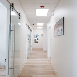 Smylique Dentistry - Our modern office features clean lines, warm wood tones, and an open, inviting feel designed with your comfort in mind.