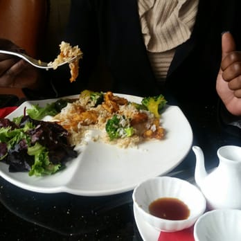 Grace's Mandarin - Fiance eating chicken, shrimp, brown sauce. - Asian Fusion Near Me - Oxon Hill, Maryland