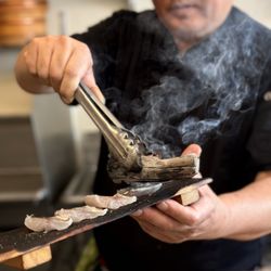 Sushi Masuyoshi - Chef Masuyoshi cooking barracuda