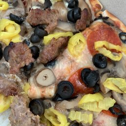 Italian sausage, pepperoni, banana peppers, mushrooms and black olives. Italian sausage, pepperoni, banana peppers, mushrooms and black olives.
