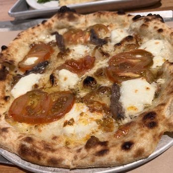 Le Central - Heirloom (anchovies, tomatoes, mozzarella ) pizza from Heirloom - Desserts Near Me - Montreal, Quebec