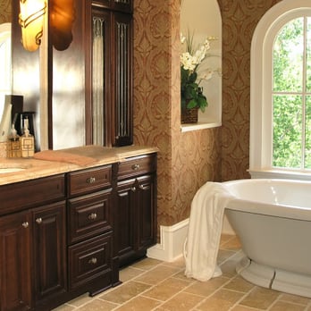 EWM Finish Carpentry - Bathroom with standalone tub, antique brass fixtures, travertine tile floor, and art deco lighting - General Contractors Near Me - Altadena, California EWM Finish Carpentry - Bathroom with standalone tub, antique brass fixtures, travertine tile floor, and art deco lighting - General Contractors Near Me - Altadena, California