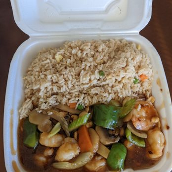 Dragon Palace - a takeout container with rice and vegetables - Chinese Near Me - Seward, Nebraska