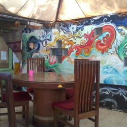 Khas Food House - A colorful mural decorates the kitchen wall.