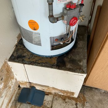 Up To Code Plumbing - Major water heater leak in the garage causing drywall damage to walls, floors, and cabinets. - Plumbing Near Me Up To Code Plumbing - Major water heater leak in the garage causing drywall damage to walls, floors, and cabinets. - Plumbing Near Me