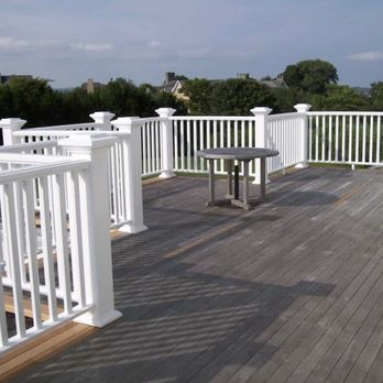 LJD Home Improvements - a deck with a table and chairs - General Contractors Near Me LJD Home Improvements - a deck with a table and chairs - General Contractors Near Me