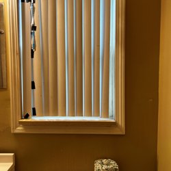 Sandman Motel - Broken blinds were taped up