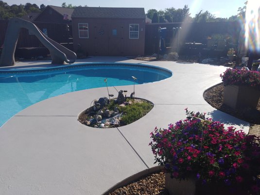Pool Refinishing - The concrete around this pool was completely ate up, peeling, and flaking. It took 3 days of completely cleaning the surface and prepping it for the rubberized coating.
