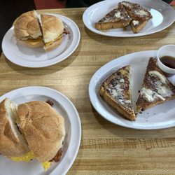 Sunny Side Up - Breakfast sandwich (bacon egg and cheese) and French toast.