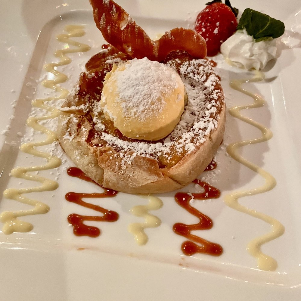 Chez Max Restaurant - Tarte Vieille France  Apple and peach tarte made with almond butter served with vanilla ice cream, chocolate and caramel sauce. - French Near Me - Richmond, Virginia
