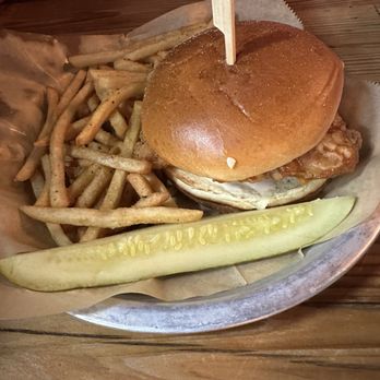 Paisley Pig - Twisted tang chicken sandwich (combo of buffalo and Carolina gold sauce) with upgrade to seasoned fries - Gastropubs Near Me - Grand Haven, Michigan Paisley Pig - Twisted tang chicken sandwich (combo of buffalo and Carolina gold sauce) with upgrade to seasoned fries - Gastropubs Near Me - Grand Haven, Michigan