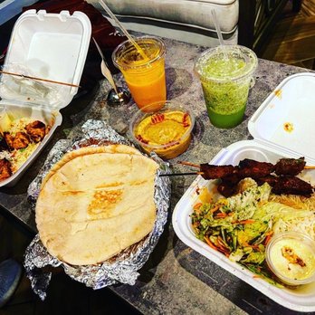 Zaman Cuisine - a variety of food items on a table - Halal Near Me - Orlando, Florida Zaman Cuisine - a variety of food items on a table - Halal Near Me - Orlando, Florida