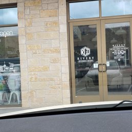 Exterior outside entrance of Rivery Coffee and Bagels - Georgetown, Texas Exterior outside entrance of Rivery Coffee and Bagels - Georgetown, Texas