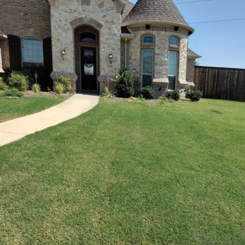 Green Bridge Lawn and Landscape - Before mulch was added to flower beds. - Lawn Services Near Me