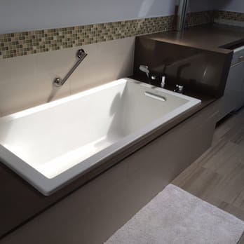 Artcore Construction - a bathroom with a washer and dryer - General Contractors Near Me - San Francisco, California Artcore Construction - a bathroom with a washer and dryer - General Contractors Near Me - San Francisco, California