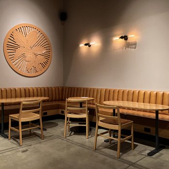 Starbucks - a corner seating area with a clock on the wall - Coffee & Tea Near Me - Delano, California Starbucks - a corner seating area with a clock on the wall - Coffee & Tea Near Me - Delano, California