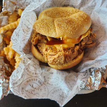 Chick Fry - Spicy zinger sandwich very good - A fried chicken sandwich with a crispy chicken fillet, pickles, and sauce in a sandwich bun, wrapped in branded paper. - Fast Food Near Me - Plano, Illinois