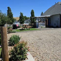 Snowy Owl Retreats - Outside there is a covered porch, picnic table, BBQ, and firepit for your enjoyment.
