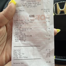a person holding a receipt a person holding a receipt