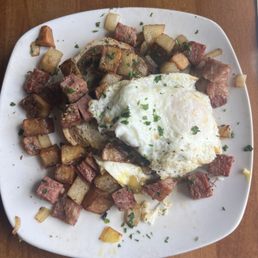 Corned Beef Hash atop Rye bread with potatoes and an egg (prepared over medium) Corned Beef Hash atop Rye bread with potatoes and an egg (prepared over medium)
