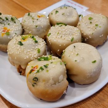 Sang-Ji Fried Bao - Orange tops: truffle fried bao Plain tops: pork sang-ji bao - Dumplings Near Me - Toronto, Ontario Sang-Ji Fried Bao - Orange tops: truffle fried bao Plain tops: pork sang-ji bao - Dumplings Near Me - Toronto, Ontario