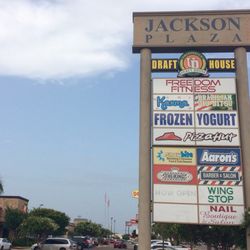 The King Barber & Salon - Located in Jackson Plaza in between Aaron's and Wingstop. Just west of Chili's.