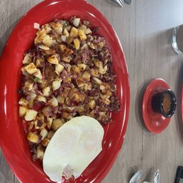 The made from scratch corn beef hash, eggs and country potatoes with habanero salsa. The made from scratch corn beef hash, eggs and country potatoes with habanero salsa.