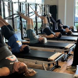 Radical Change Pilates & Wellness - Pilates Tower during group Pilates class at Radical Change Pilates & Wellness