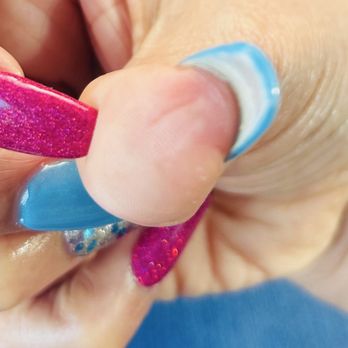 Top Nails Spa - The thumb where my nail bed separated from the skin. There's no blood because it went away after the nail tech had me wash my hands. - Nail Salons Near Me - Fresno, California