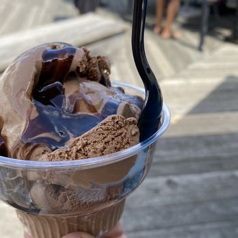 Captain's Cove Seaport - a hand holding a cup of ice cream - Bars Near Me - Bridgeport, Connecticut Captain's Cove Seaport - a hand holding a cup of ice cream - Bars Near Me - Bridgeport, Connecticut
