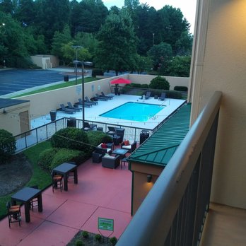 Courtyard by Marriott Burlington - Balcony view of pool and courtyard - Hotels Near Me - Burlington, North Carolina