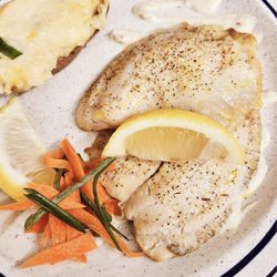 The Dell Steakhouse & Lounge - The tilapia special with stuffed potato.